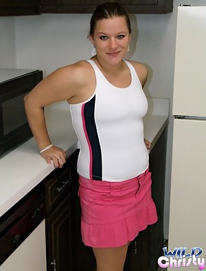 Ponytailed juicy teen knockout Christy showing her massive breasts in the kitchen